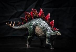 dinosaur , Stegosaurus in the dark photo