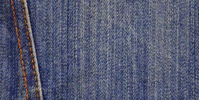 Detailed texture of dark denim cloth photo