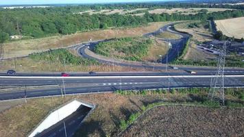 High Angle View of Luton Airport Junction Interchange of Motorways M1 J10 at Luton City of England UK. it is Connection Luton City and London Luton Airport Image Created on 11th August 2022 with Drone video