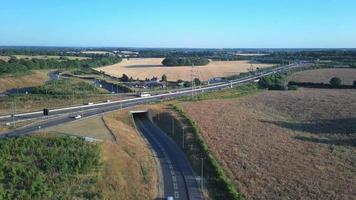 High Angle View of Luton Airport Junction Interchange of Motorways M1 J10 at Luton City of England UK. it is Connection Luton City and London Luton Airport Image Created on 11th August 2022 with Drone video
