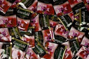 KHARKOV, UKRAINE - DECEMBER 8, 2020 Greenfield Spring Melody tea bags. Greenfield manufactured by Orimi Trade and Greenfield Tea ltd. photo