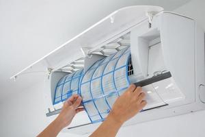 man hand hold air conditioner filter cleaning concept photo