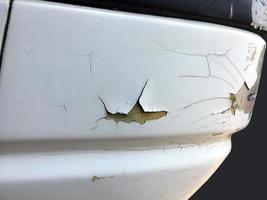 The paint sheet on the outside surface of the car is cracked into various shapes according to the condition and time of use of the car photo