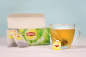 KHARKOV, UKRAINE - DECEMBER 8, 2020 Lipton classic green tea bags. Lipton is a British brand of tea owned by Unilever and PepsiCo photo