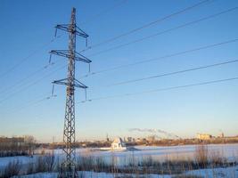 Power line. Pillar. Metal tower. Electricity in the city. photo