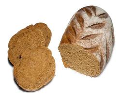 Sliced loaf of black bread on a white background.  Healthy food. photo