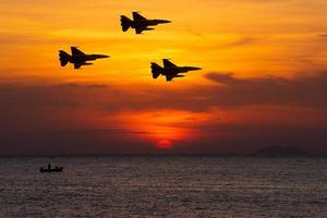 Silhouette airplane with beautiful colorful sunset sky background. photo