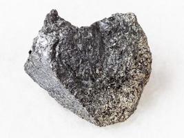peridotite stone with phlogopite mica on white photo