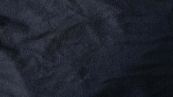 High resolution, detail shot of soft Black gray fabric background. Polyester and cotton clothing wallpaper with copy space for text. photo