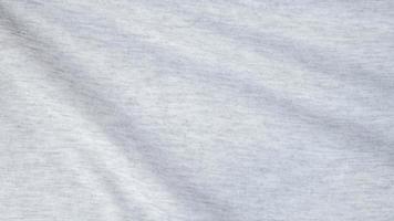 High resolution, detail shot of soft white gray jersey fabric background. Polyester and cotton clothing wallpaper with copy space for text. photo