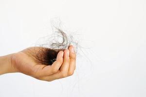 Hair loss in the brush of the woman photo