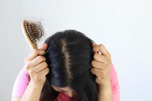 Hair loss in the brush of the woman photo