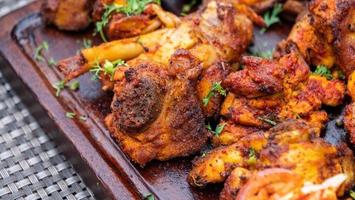 Grilled chicken in a plate photo