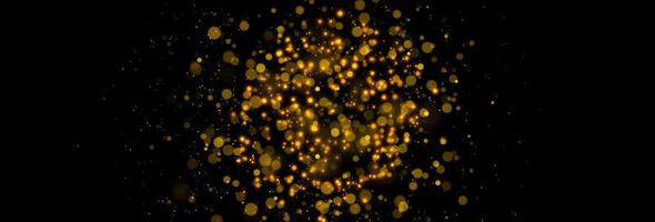 Gold glittering stars dust and bokeh background. Abstract christmas glow light texture. photo