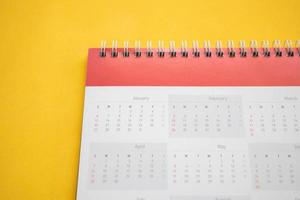 calendar page on yellow background business planning appointment meeting concept photo