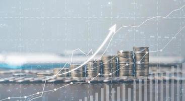 Banking Finance Investment Business Concept. Double exposure image of bank or coin money and graph chart with city background. Account management diagram with market growth statistics. economy datum. photo