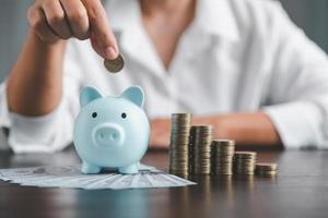 Saving investment banking finance concept. Stack of coins with piggy bank on the table. Growth of loan and investment business idea. Asset Management, Funds, Liabilities, Deposits, Income, Successful. photo