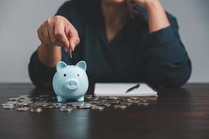 Saving investment banking finance concept. Stack of coins with piggy bank on the table. Growth of loan and investment business idea. Asset Management, Funds, Liabilities, Deposits, Income, Successful. photo