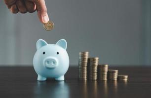 Saving investment banking finance concept. Stack of coins with piggy bank on the table. Growth of loan and investment business idea. Asset Management, Funds, Liabilities, Deposits, Income, Successful. photo