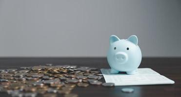 Saving investment banking finance concept. Stack of coins with piggy bank on the table. Growth of loan and investment business idea. Asset Management, Funds, Liabilities, Deposits, Income, Successful. photo