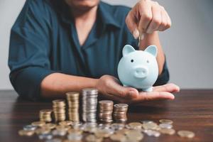 Saving investment banking finance concept. Stack of coins with piggy bank on the table. Growth of loan and investment business idea. Asset Management, Funds, Liabilities, Deposits, Income, Successful. photo