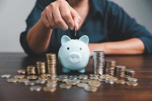 Saving investment banking finance concept. Stack of coins with piggy bank on the table. Growth of loan and investment business idea. Asset Management, Funds, Liabilities, Deposits, Income, Successful. photo