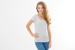 Young blonde woman with fit slim body in blank template t shirt and jeans isolated on white background. Skin and hair care. Copy space and mock up photo