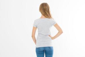 Woman in template blank t shirt isolated on white background. Back view. Mock up. Copy space. photo