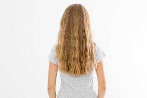 Blonde girl with long and wavy healthy hair isolated on white background. Young woman fashion hairstyle back view. Template and blank copy space. photo
