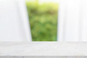 Empty marble table top with blur window curtain background for product display photo