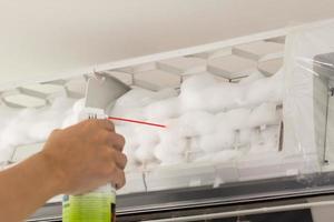 air conditioner cleaning with spray foam cleaner photo