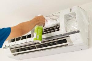 air conditioner cleaning with spray foam cleaner photo