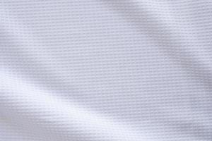 Ropa deportiva blanca tela camiseta de fútbol jersey textura resumen antecedentes foto