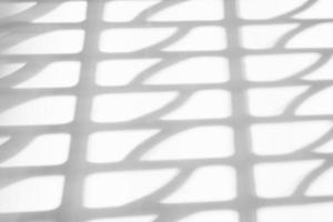 Abstract shadow drop on white wall background photo