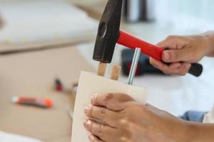 Man assembling furniture at home photo