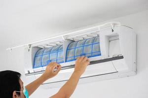 man hand hold air conditioner filter cleaning concept photo