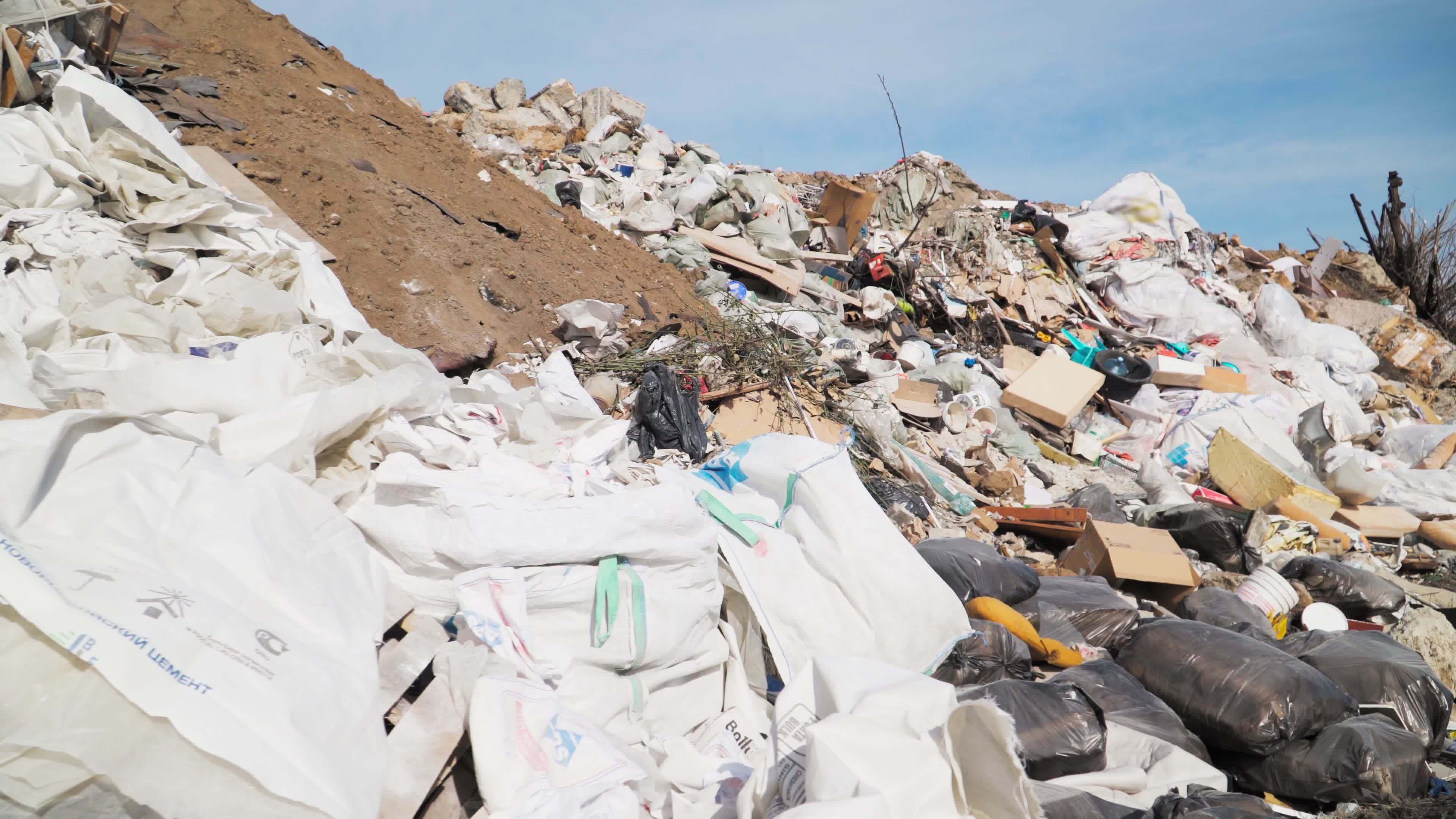 Big piles of garbage. Empty bottles, plastic in the waste dump