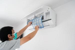 man hand hold air conditioner filter cleaning concept photo