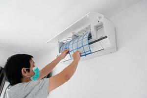 man hand hold air conditioner filter cleaning concept photo