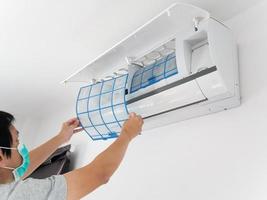 man hand hold air conditioner filter cleaning concept photo