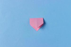 Step 4. Origami pig head. Take the figure at the other two opposite corners and fold it in half photo