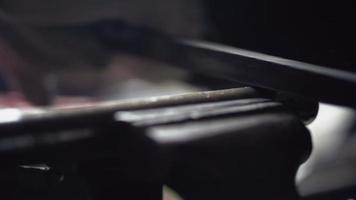 Rasp File Held in Gloved Hands is Used to Smooth the Rough Edges on a Silver Metal Pipe Being Held in a Vice. Sharpening Metal. Close Up. Unrecognizable Person. High quality 4k footage video