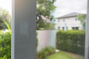 mosquito net wire screen on house window protection against insect photo