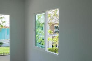 Empty room with glass window frame house interior on concrete wall photo