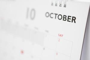 página del calendario de octubre con meses y fechas concepto de reunión de cita de planificación empresarial foto