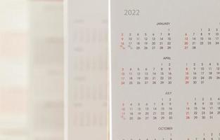 Close up 2022 calendar page dates and month background business planning appointment meeting concept photo