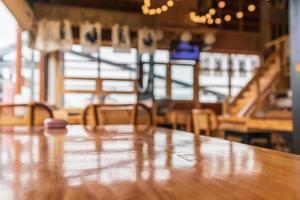 Empty wood table top with blurred Japanese restaurant background photo