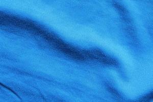 fondo de ropa deportiva de textura de tela de ropa de camiseta de fútbol azul foto