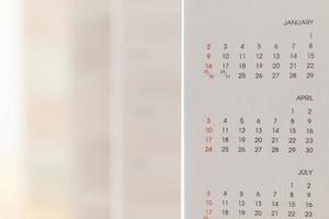 Close up calendar page dates and month background business planning appointment meeting concept photo