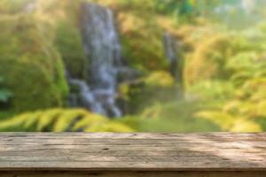 Empty wood table top with abstract blur park garden pond background photo